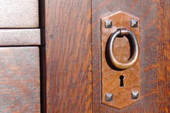 Close-up detail hand-hammered door pull.